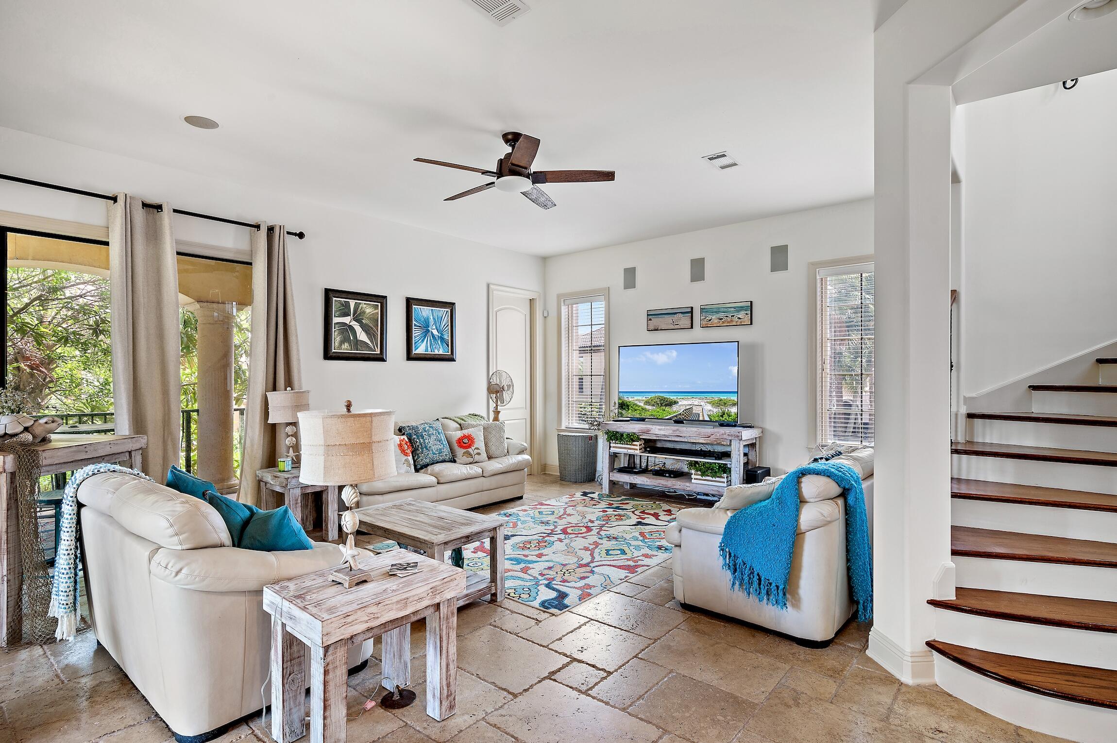 215 Rue St Tropez Miramar Beach, FL 32550 - Photo 18 of 46 a living room with furniture a flat screen tv and a window