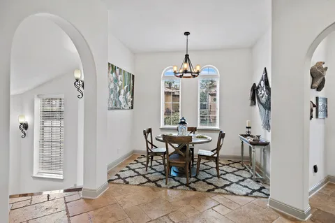a view of staircase with railing and white walls