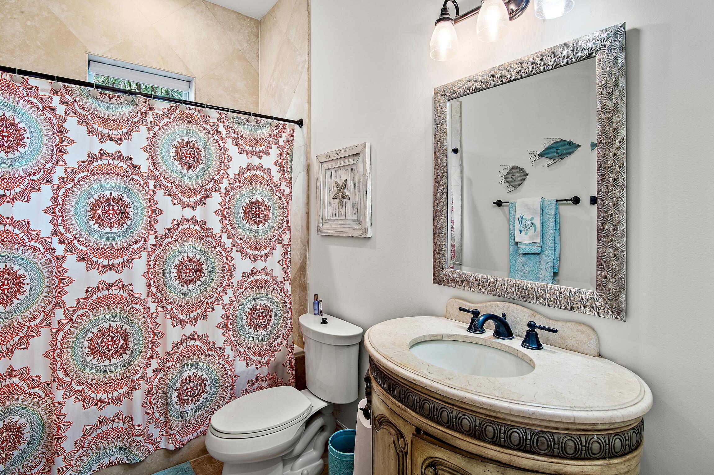 215 Rue St Tropez Miramar Beach, FL 32550 - Photo 23 of 46 a bathroom with a sink and a mirror