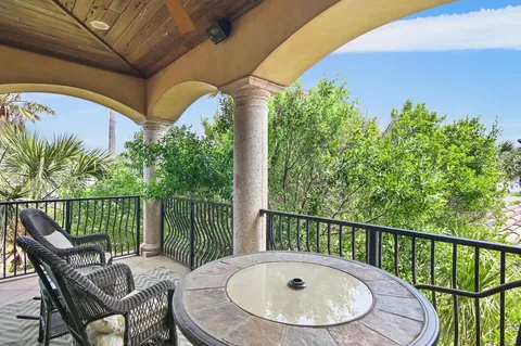 a view of a balcony with furniture