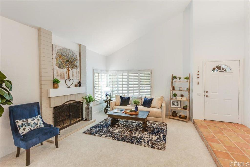 13411 Appalachian Way San Diego, CA 92129 - Photo 2 of 12 a living room with furniture and a fireplace