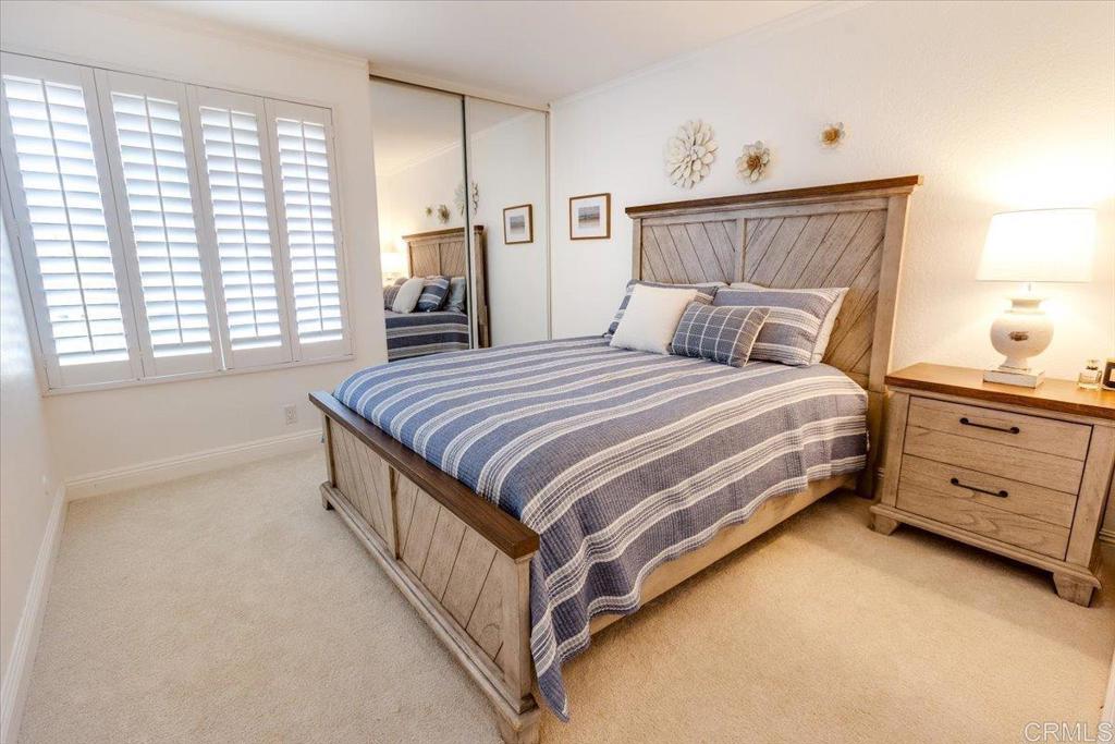 13411 Appalachian Way San Diego, CA 92129 - Photo 9 of 12 a bedroom with a bed and a window in it