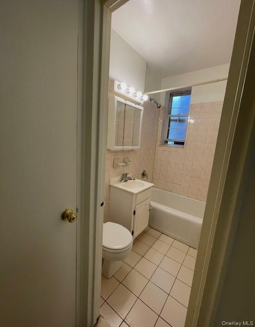 776 Bronx River Road, Unit B24 Bronxville, NY 10708 - Photo 2 of 9 Full bath with vanity, light tile patterned floors, and tub / shower combination