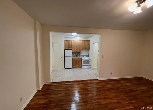 a kitchen with a refrigerator sink stove and cabinets