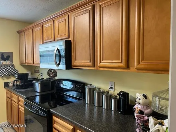 a kitchen with sink and cabinets