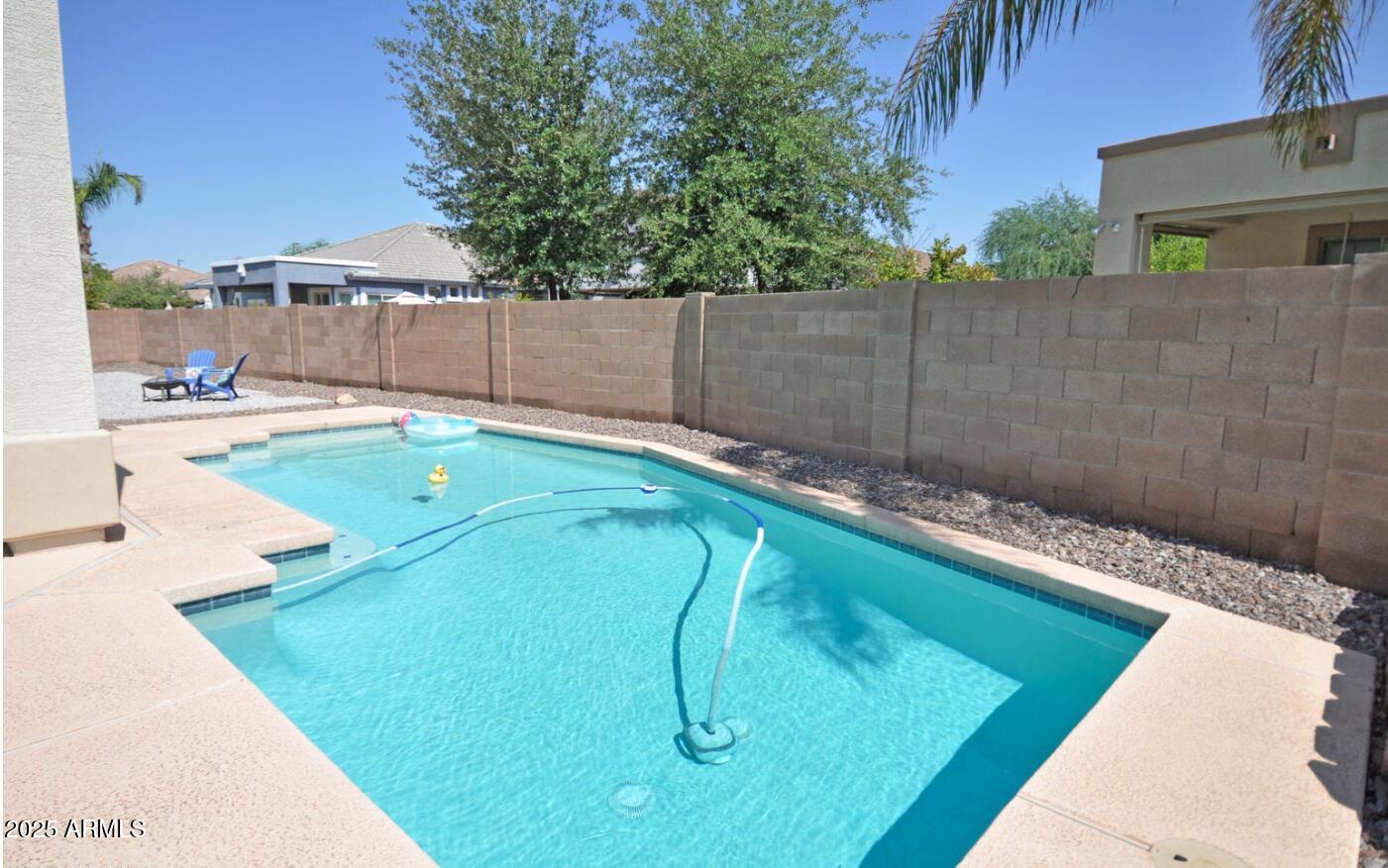 3530 East Los Altos Road Gilbert, AZ 85297 - Photo 1 of 20 a view of a backyard with a small pool and sitting area