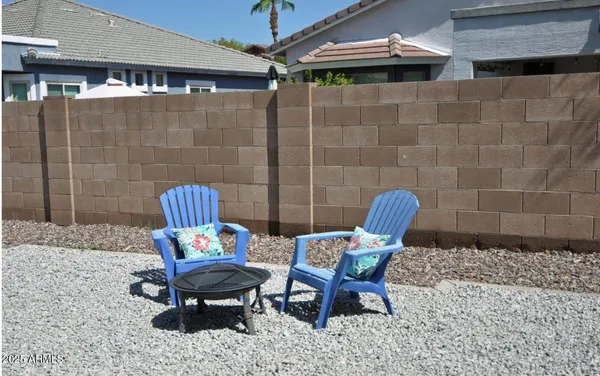 a outdoor seating area with furniture and rug