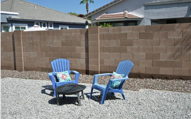 a outdoor seating area with furniture and rug