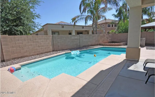 a view of a backyard with a sitting area