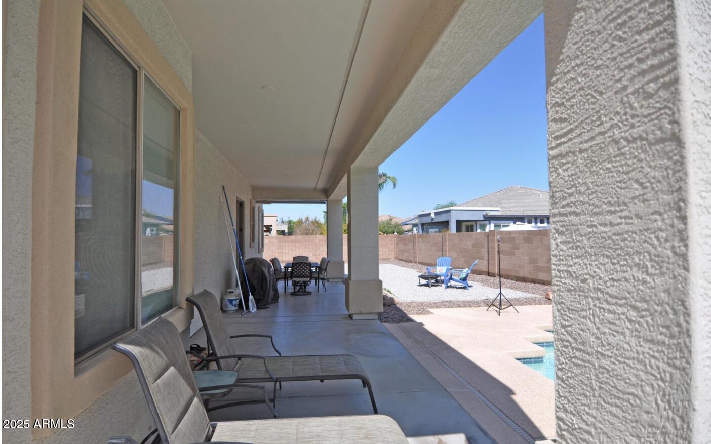 3530 East Los Altos Road Gilbert, AZ 85297 - Photo 19 of 20 a living room with furniture and a floor to ceiling window