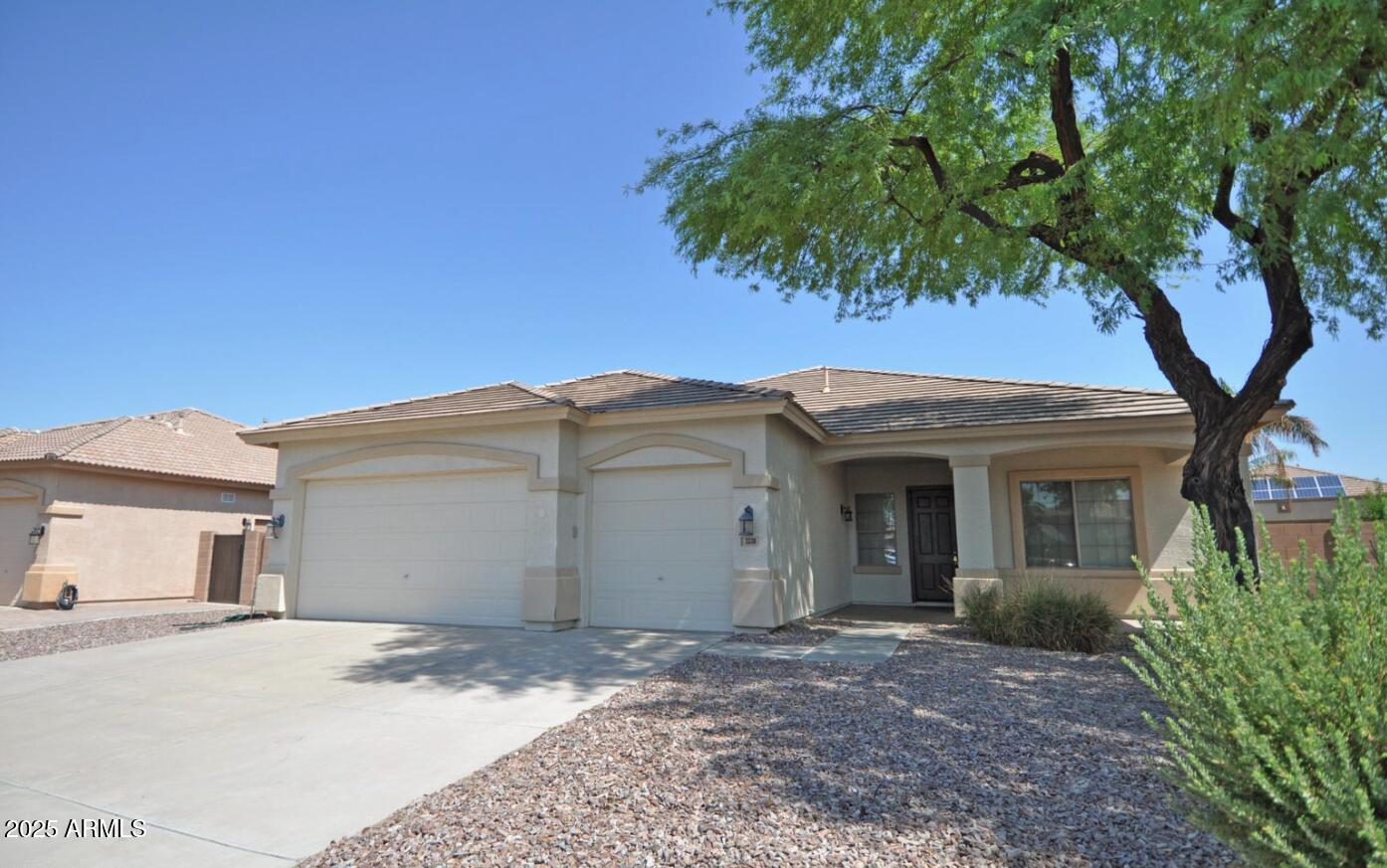 3530 East Los Altos Road Gilbert, AZ 85297 - Photo 2 of 20 a view of a house with a yard and large tree