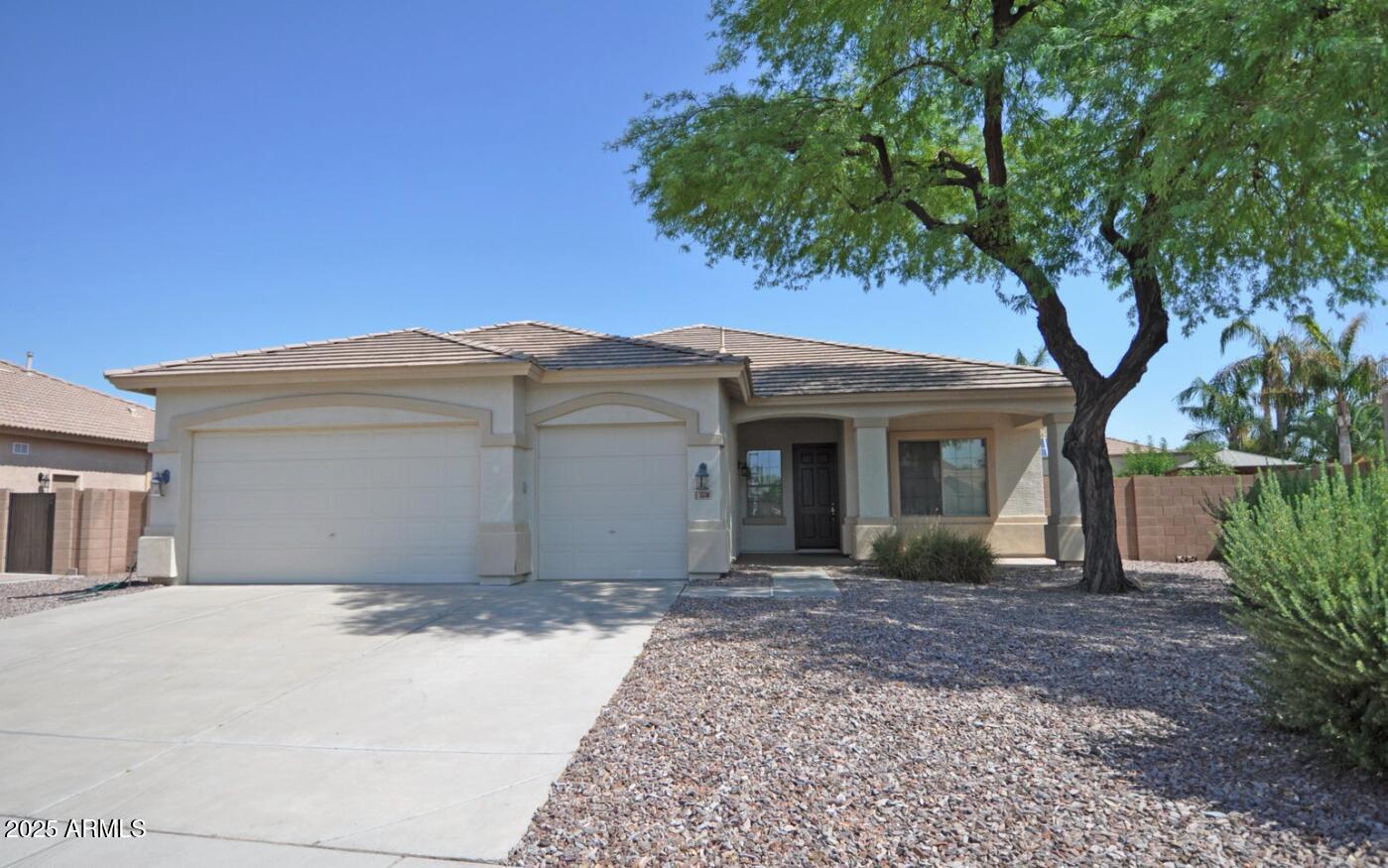 3530 East Los Altos Road Gilbert, AZ 85297 - Photo 3 of 20 a front view of a house with a garden and yard