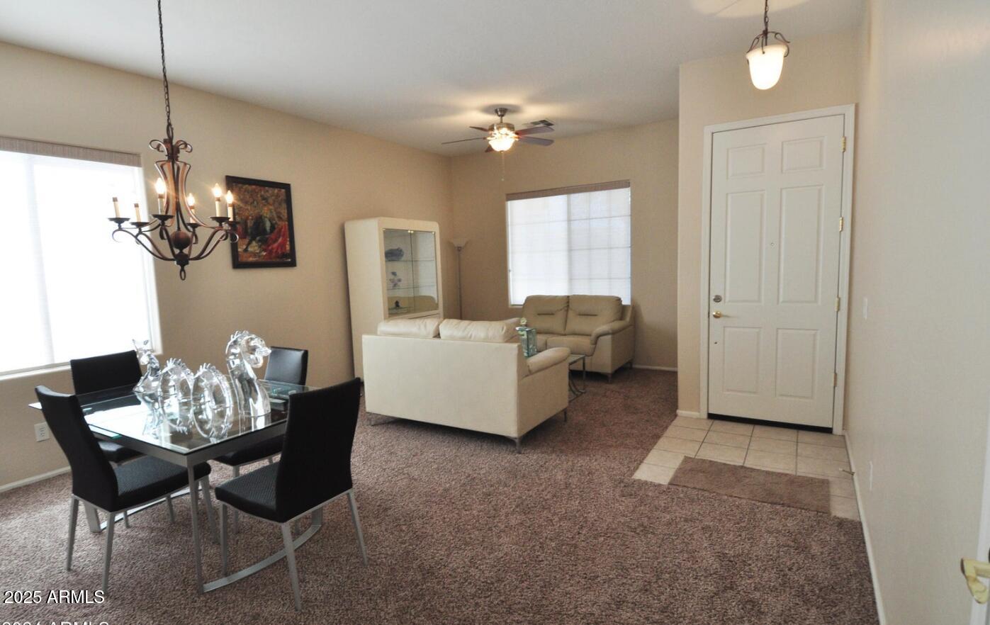 3530 East Los Altos Road Gilbert, AZ 85297 - Photo 4 of 20 a living room with furniture and chandelier