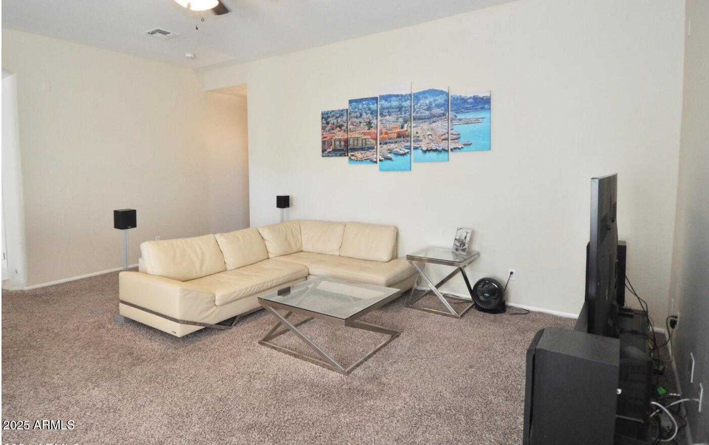 3530 East Los Altos Road Gilbert, AZ 85297 - Photo 9 of 20 a living room with furniture and a flat screen tv