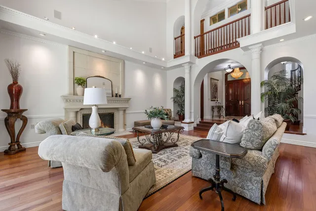 a bedroom with a bed a flat screen tv and dresser