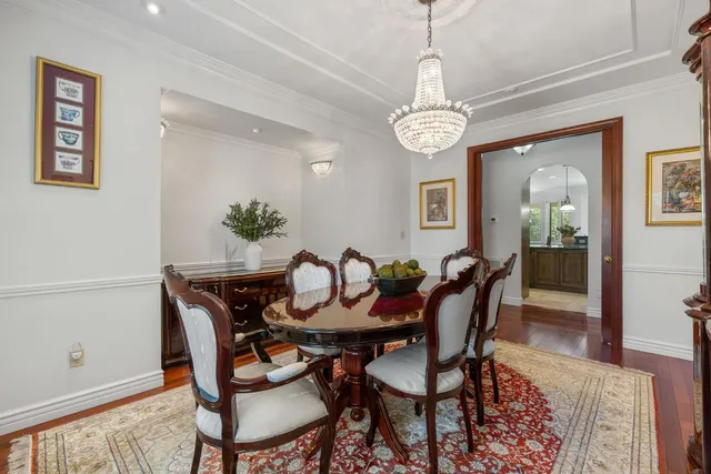 a kitchen with kitchen island granite countertop a sink cabinets and window