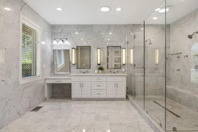 a view of a dining room with furniture a chandelier and wooden floor