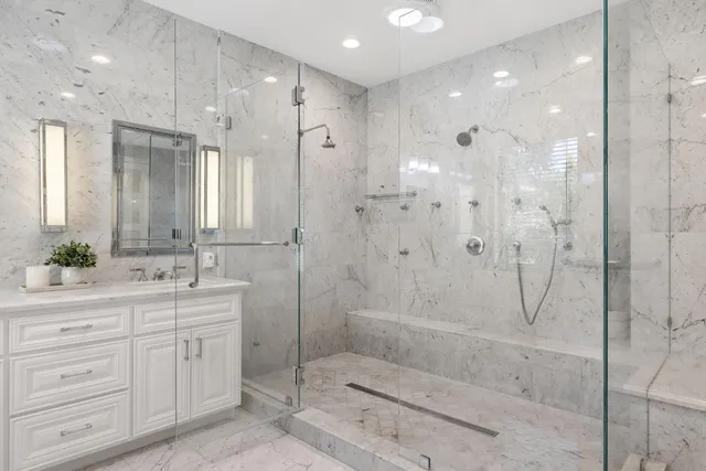 a bedroom with a bed and a potted plant