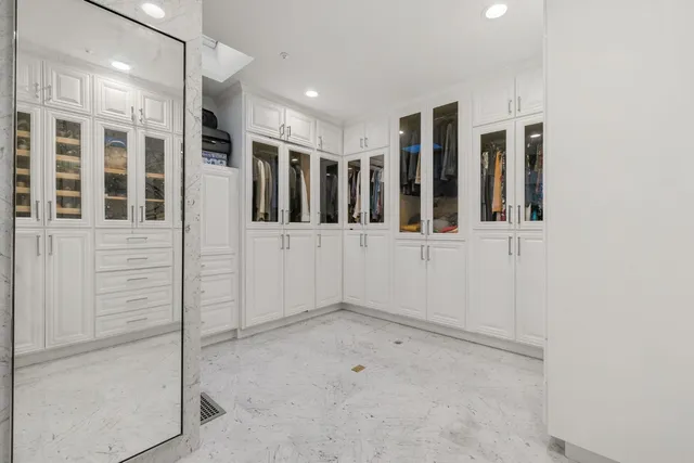 a bathroom with a granite countertop shower