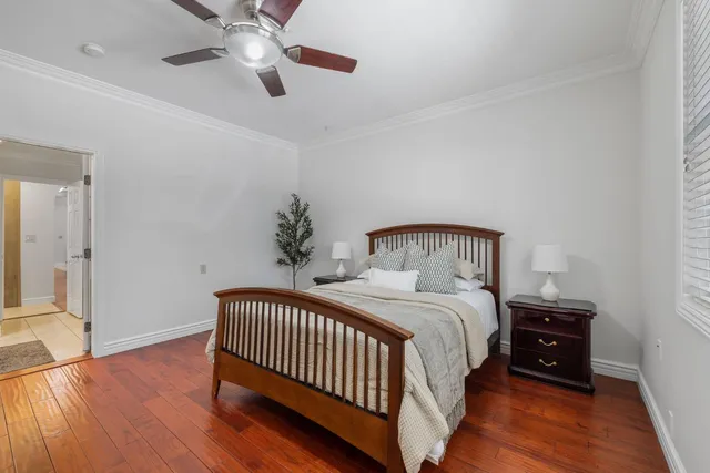 a view of a lake with a bench next to a yard