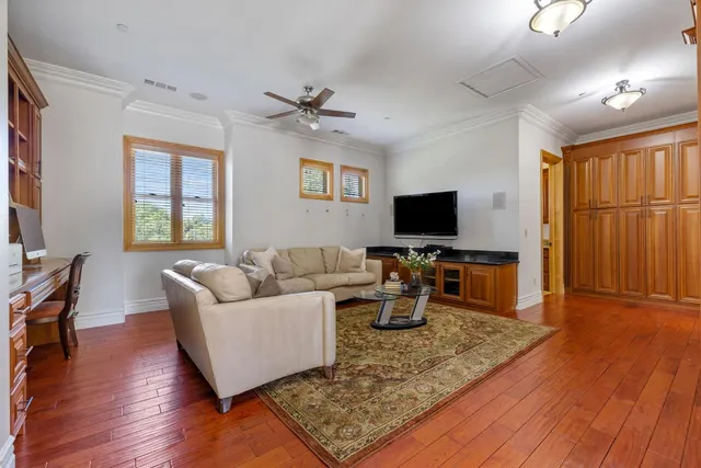 a front view of a house with swimming pool and porch