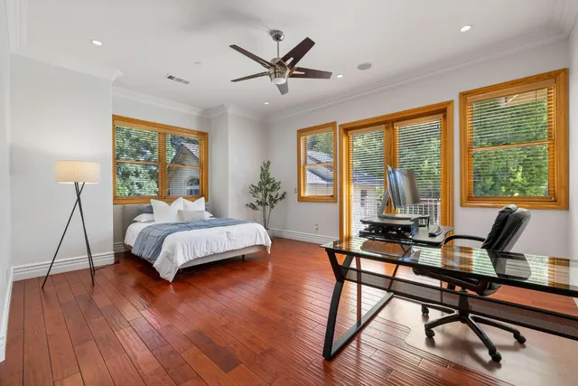 an aerial view of a house with swimming pool and garden