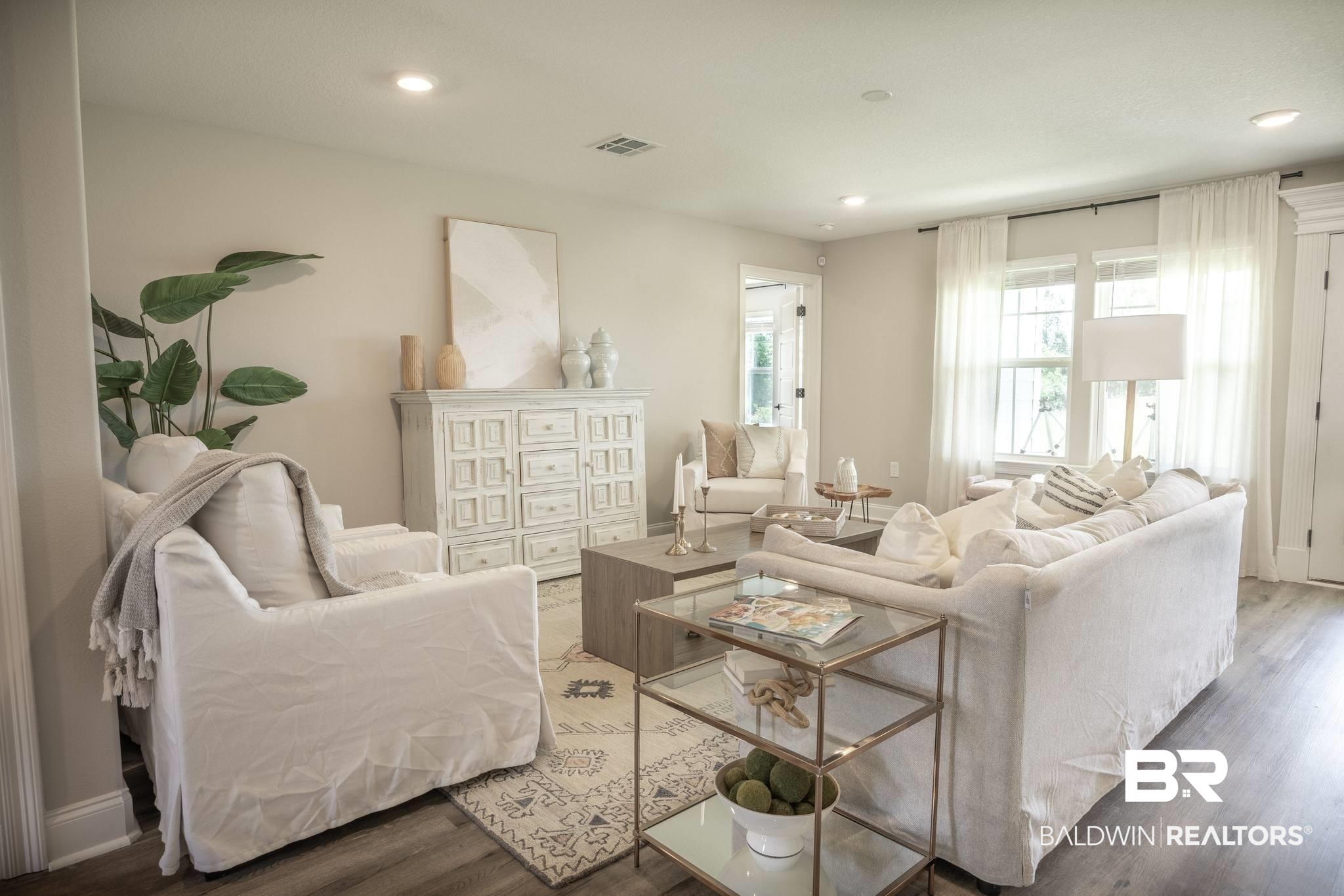 12918 Flanagan Street Elberta, AL 36530 - Photo 20 of 33 Open-concept living area featuring recessed lighting, light-toned walls, and wood-finish flooring