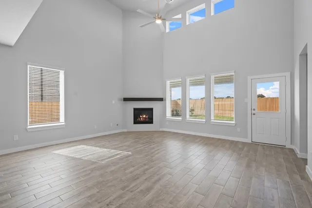a view of a kitchen with a refrigerator and a sink