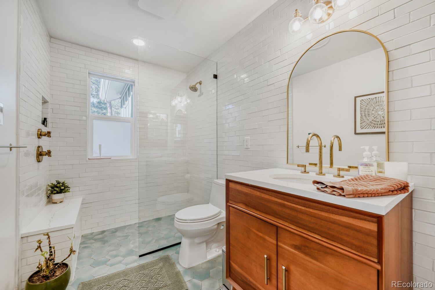 924 Kelly Road West Boulder, CO 80302 - Photo 28 of 44 a bathroom with a sink a toilet and shower