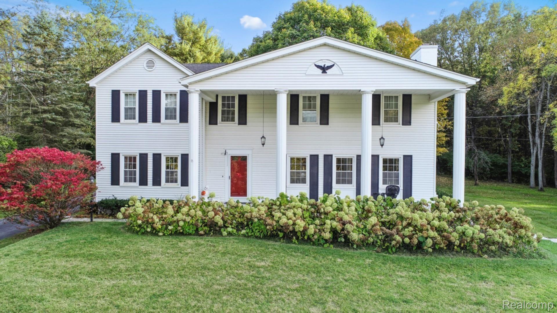 480 Tiplady Road Pinckney, MI 48169 - Photo 2 of 55 480 Tiplady - those are gorgeous hydrangeas along the front covered porch!