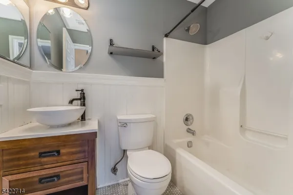 a bathroom with a sink a toilet and a bathtub