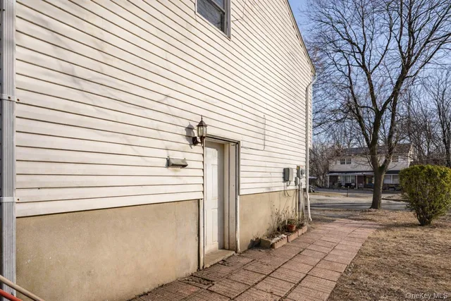 a view of a patio with table and chairs and a stove