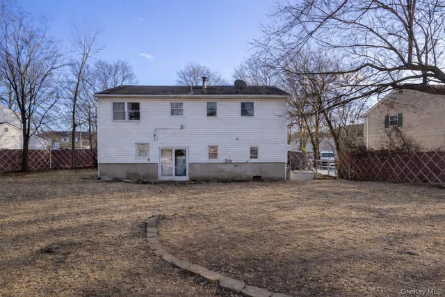 a view of a house with a snow in the yard