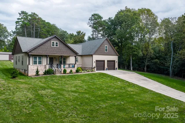 a front view of a house with a yard table and chairs