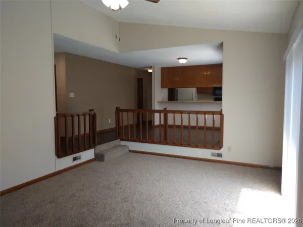 a kitchen with stainless steel appliances a refrigerator and a microwave