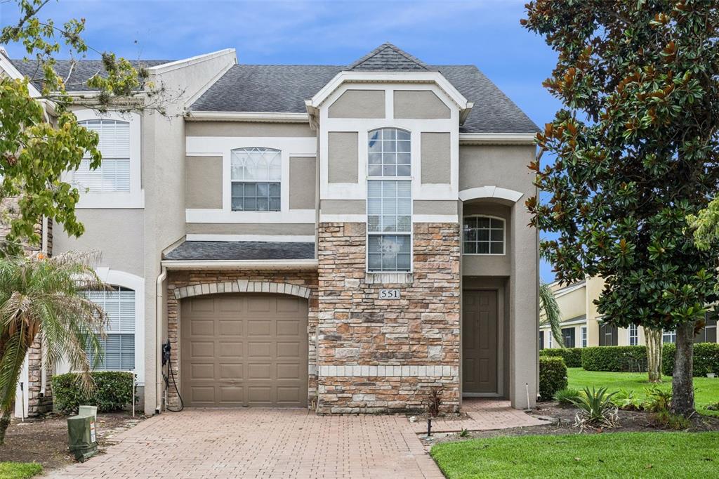 551 Terrace Spring Drive Orlando, FL 32828 - Photo 1 of 41 a front view of a house with garden