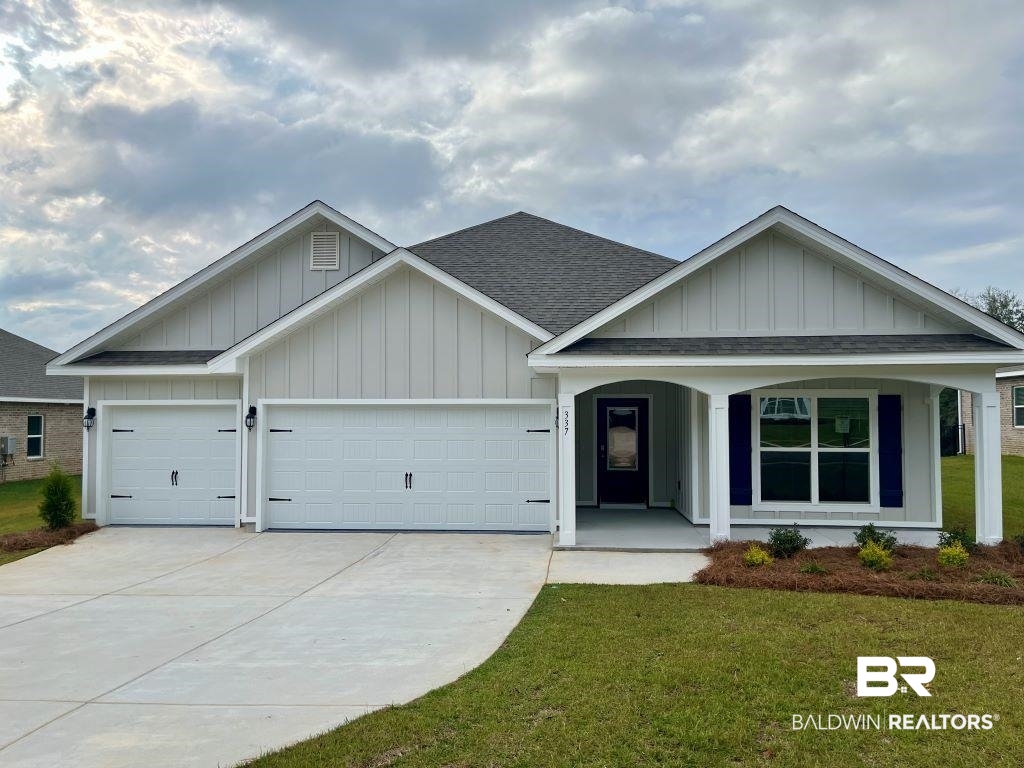 337 Barndling Street Fairhope, AL 36532 - Photo 1 of 34 Craftsman-style home featuring a garage, a front lawn, and covered porch