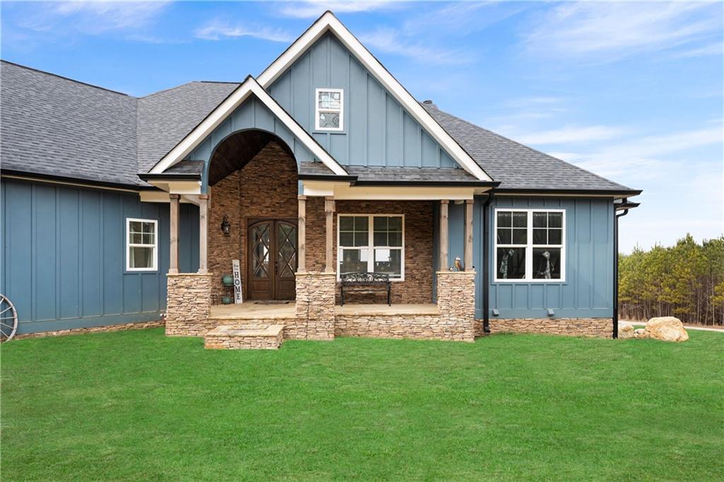 610 Cedar Creek Road Cartersville, GA 30121 - Photo 16 of 75 a front view of a house with a yard and garden