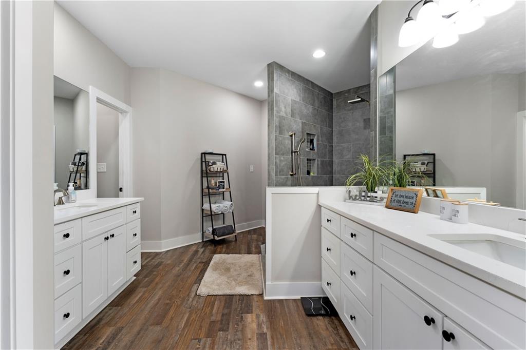 610 Cedar Creek Road Cartersville, GA 30121 - Photo 39 of 75 a spacious bathroom with a double vanity sink a mirror and shower