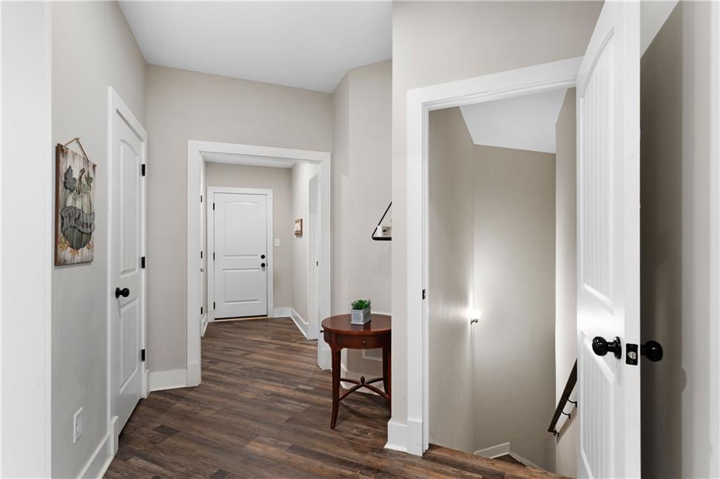 610 Cedar Creek Road Cartersville, GA 30121 - Photo 52 of 75 a view of a hallway with wooden floor and a bathroom