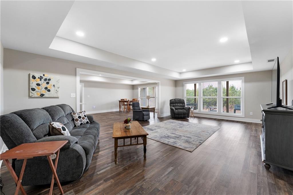 610 Cedar Creek Road Cartersville, GA 30121 - Photo 56 of 75 a living room with furniture a flat screen tv and a large window