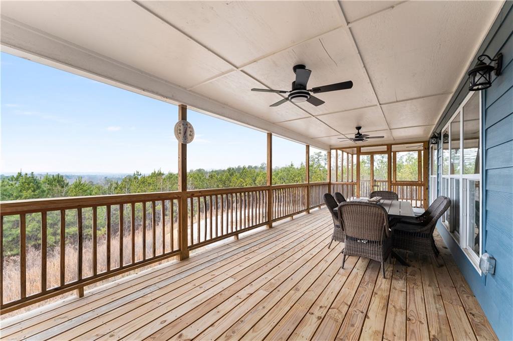610 Cedar Creek Road Cartersville, GA 30121 - Photo 68 of 75 a view of a balcony with furniture and wooden floor