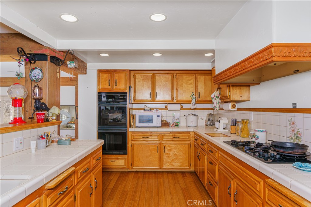 150 Pinal Avenue Santa Maria, CA 93455 - Photo 18 of 36 a kitchen with stainless steel appliances a sink and a stove
