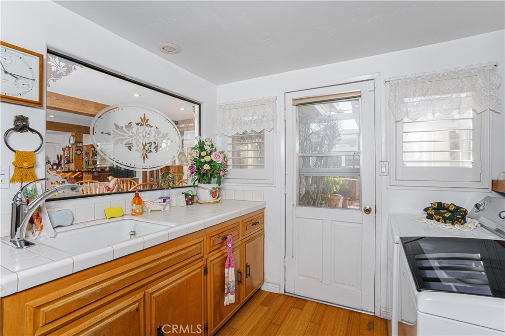 150 Pinal Avenue Santa Maria, CA 93455 - Photo 19 of 36 a kitchen with sink refrigerator and stove