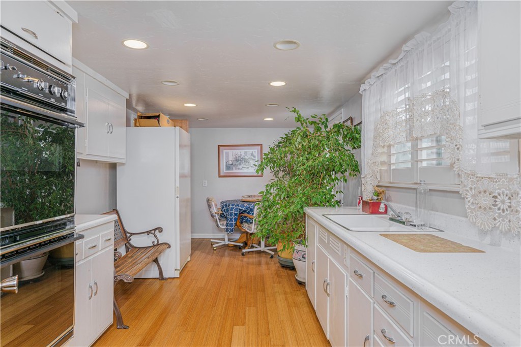 150 Pinal Avenue Santa Maria, CA 93455 - Photo 20 of 36 a kitchen with sink a counter and chairs