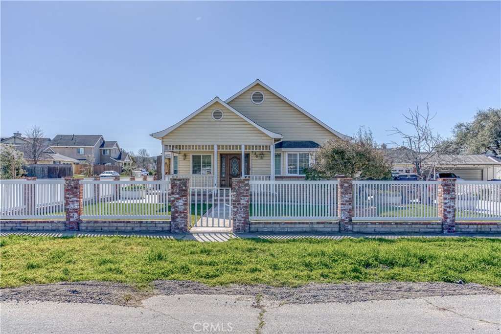 150 Pinal Avenue Santa Maria, CA 93455 - Photo 2 of 36 a front view of a house with a garden and plants