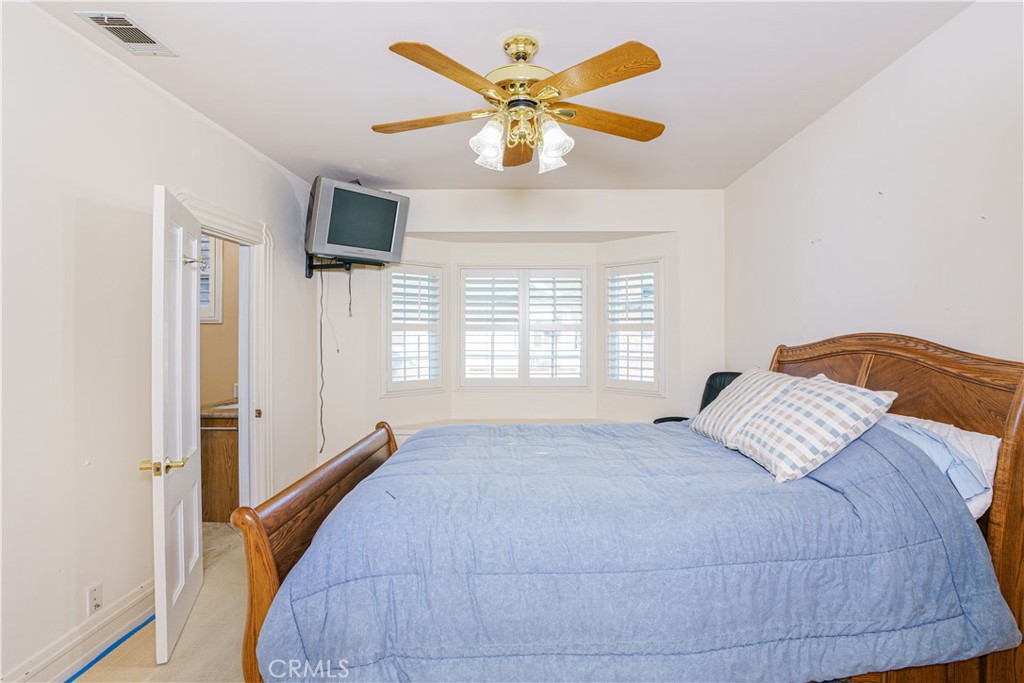 150 Pinal Avenue Santa Maria, CA 93455 - Photo 24 of 36 a bedroom with a bed and window