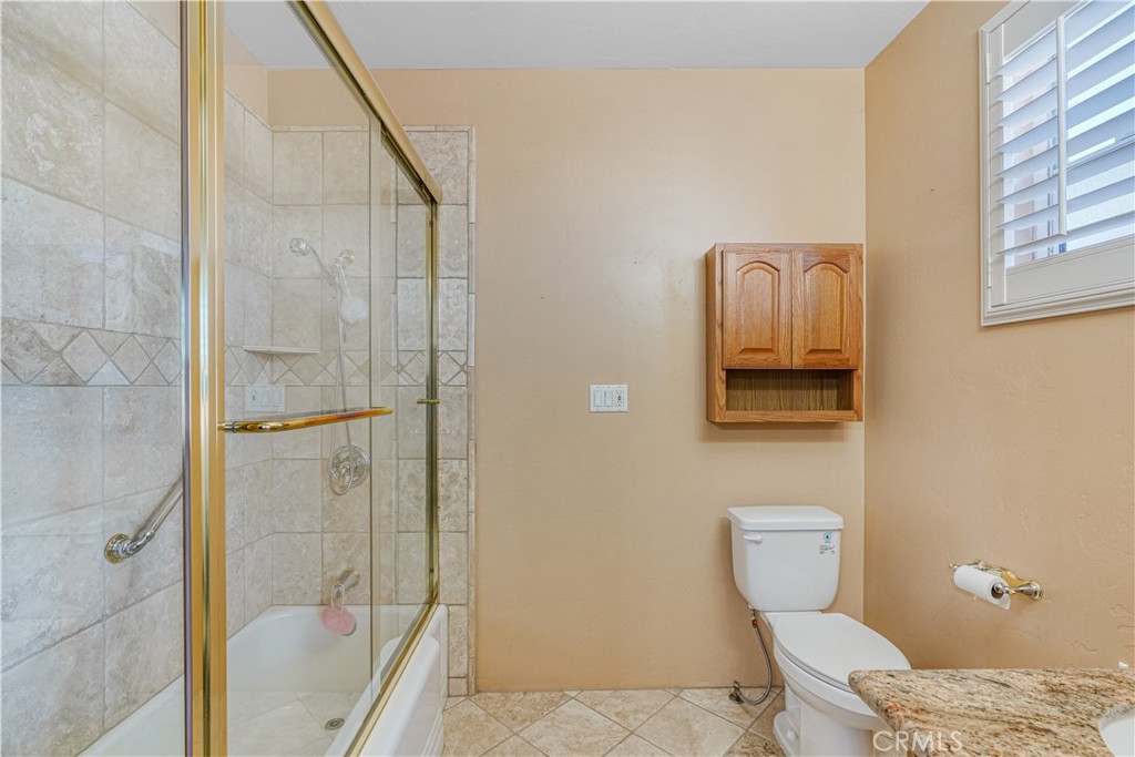 150 Pinal Avenue Santa Maria, CA 93455 - Photo 25 of 36 a bathroom with a toilet and a shower