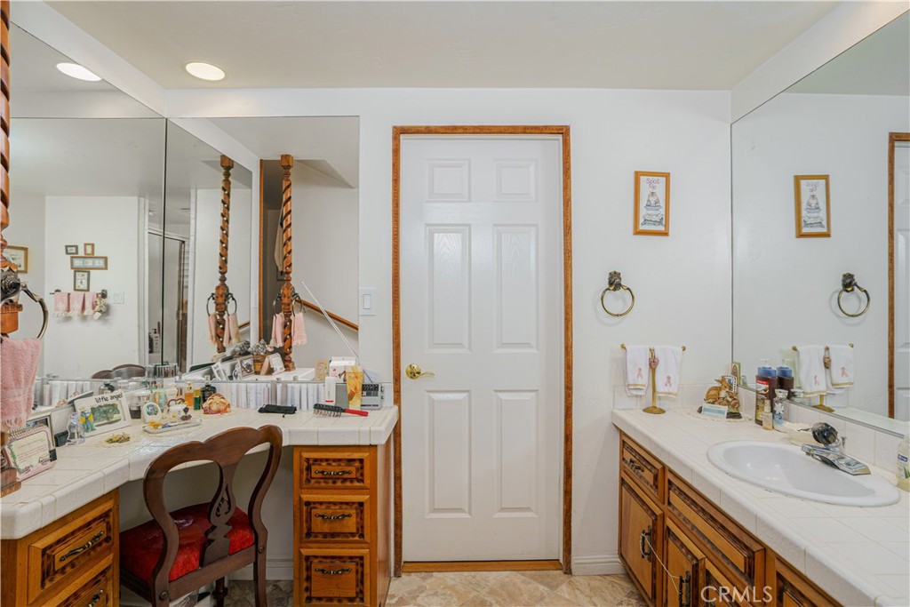 150 Pinal Avenue Santa Maria, CA 93455 - Photo 28 of 36 a en suite bathroom with a double vanity sink and a mirror