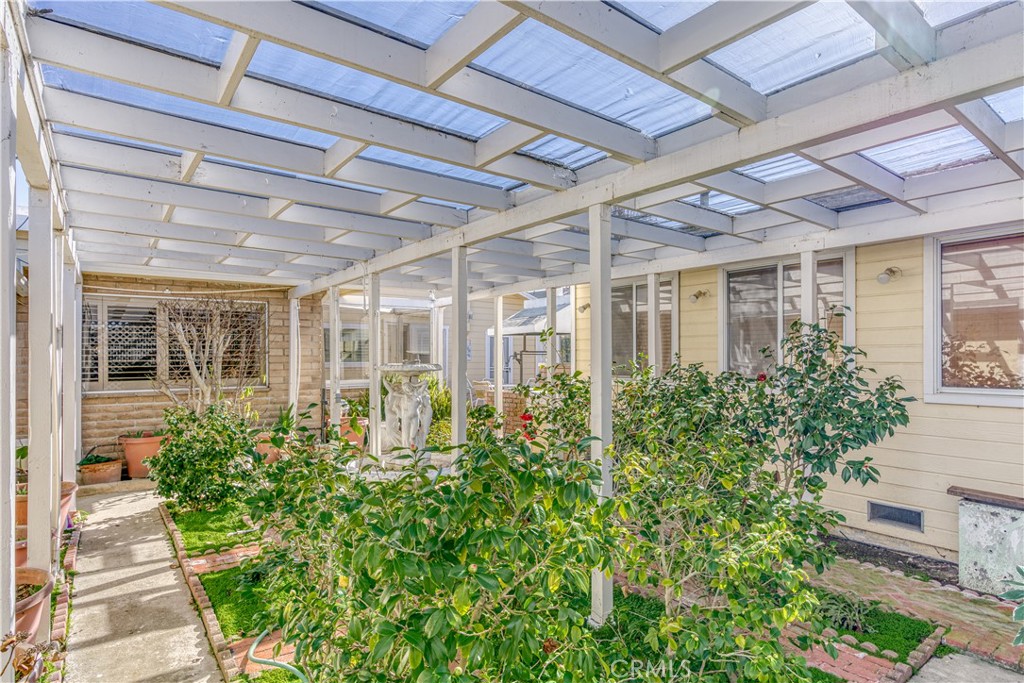 150 Pinal Avenue Santa Maria, CA 93455 - Photo 31 of 36 a view of a porch with a lot of flower plants